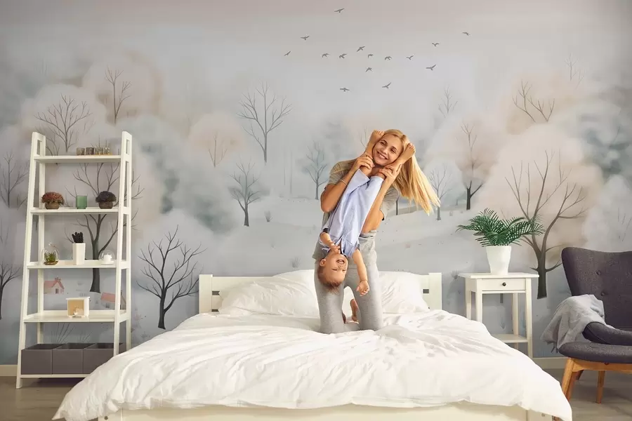 fototapeter Vinterskog med trær, små hus, fugler og snø i en lett akvarellstil w08815